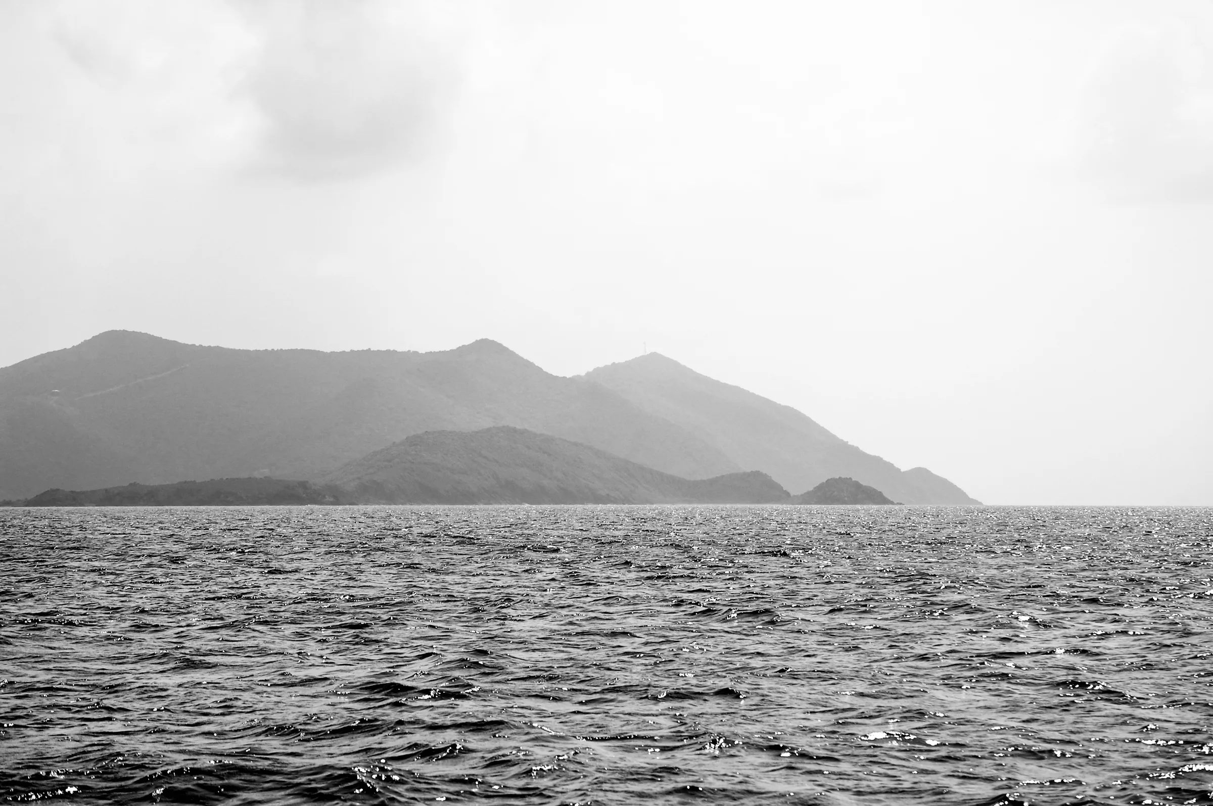 Hills in the distance, over the water, taken from a boat in the Atlantic Ocean, near Tortola.